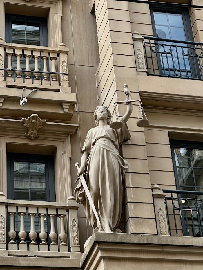 Statue of Justice on a classic building facade in Istanbul, Turkey.