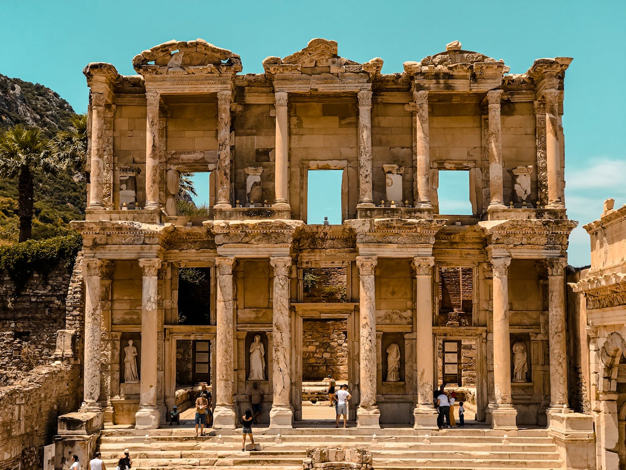 The ancient ruins of the Library of Celsus in Ephesus with detailed stone carvings and statues.